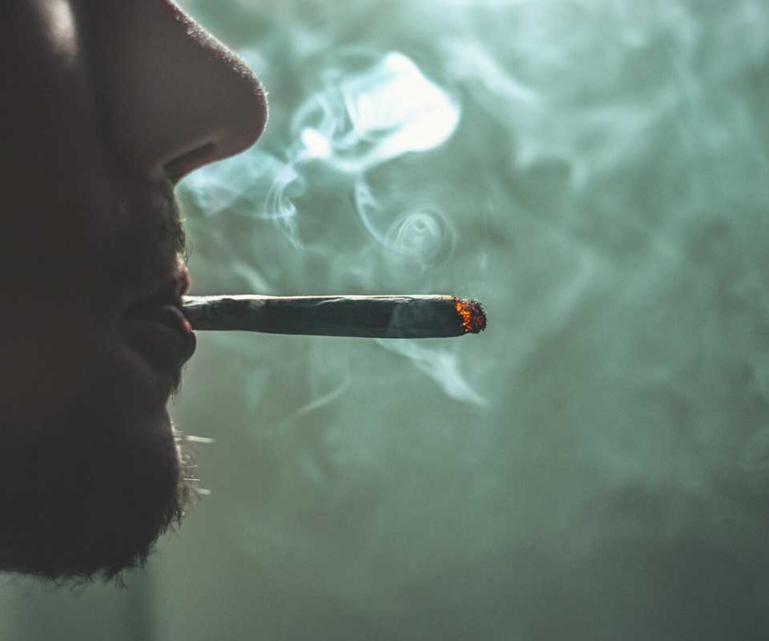 man-smoking-cigarette-zoomed-on-nose-and-lips-representing-drug-defense-attorneys-in-jacksonville