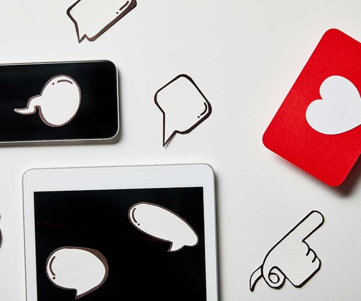 social-media-icons-and-chat-bubbles-on-different-tech-devices-shown-by-criminal-defense-attorney