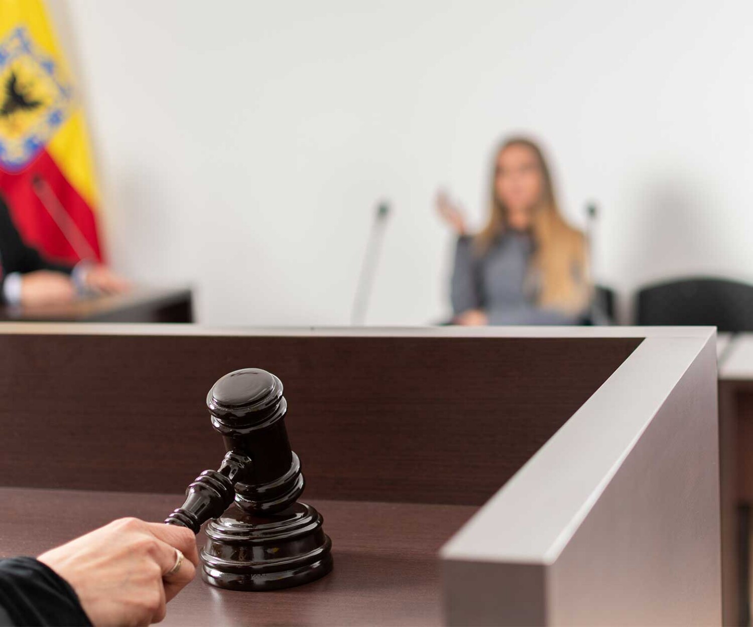 gavel-in-judges-hand-hitting-podium-with-speaker-blurred-in-background-representing-jacksonville-criminal-defense-attorney