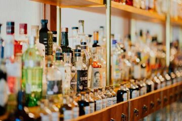 shelf-of-liquor-in-bar-showing-dui-lawyer-helps-explain-underage-dui-laws-and-penalties-in-jacksonville